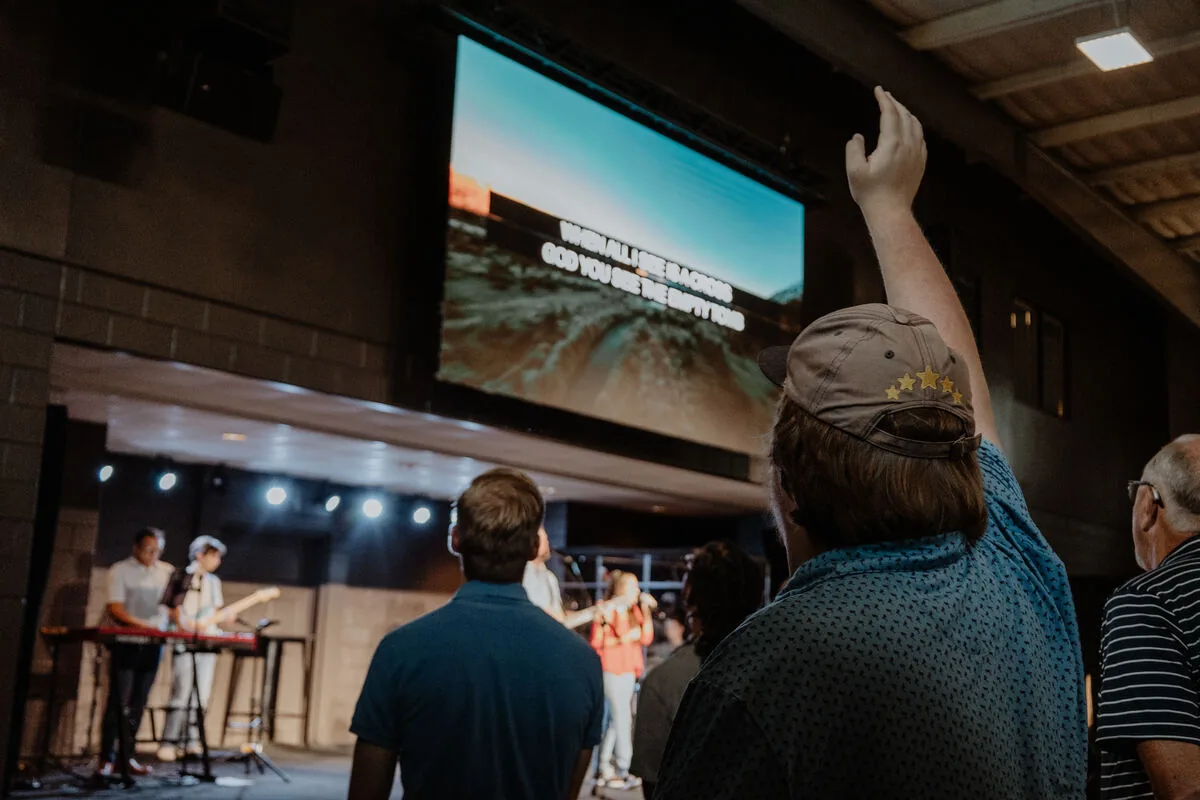 A hand raised during worship.