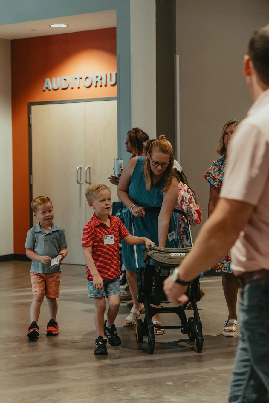 Heading in past the auditorium doors.