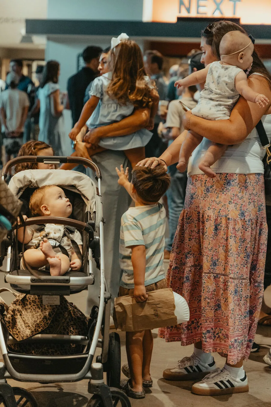 A mother and her children in the lobby.