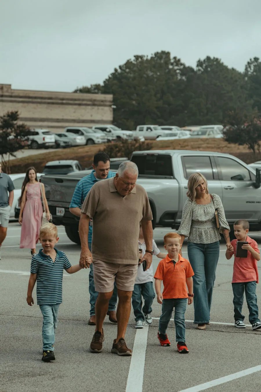 Walking in together across the parking lot.