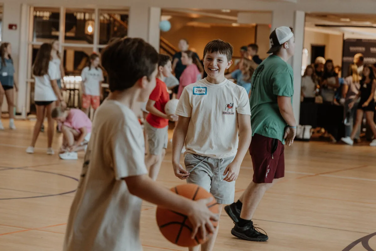 A game of basketball in the gym.