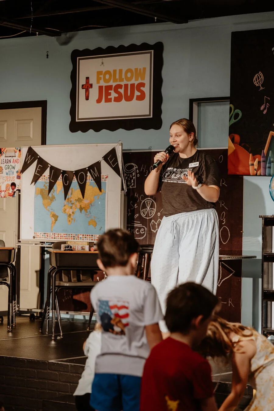A leader teaching in a kids classroom.