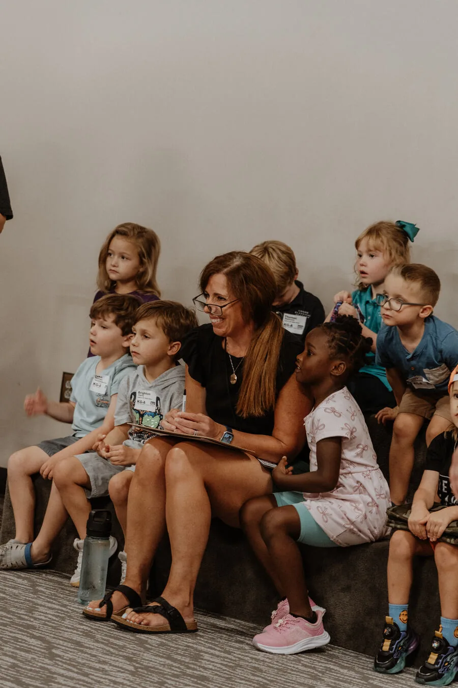 Children sitting together with a leader.