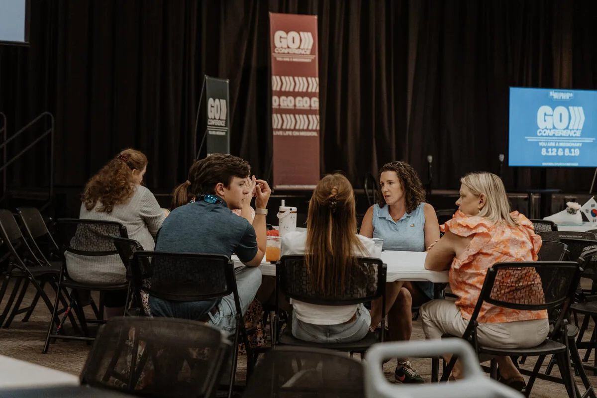 Listening at the tables.