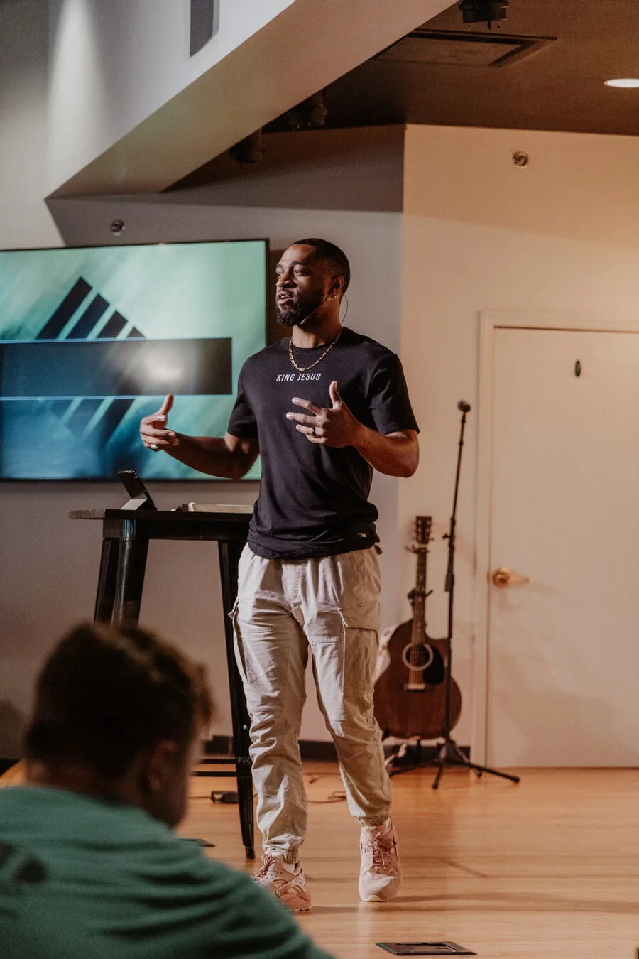 Teaching in front of the screen.