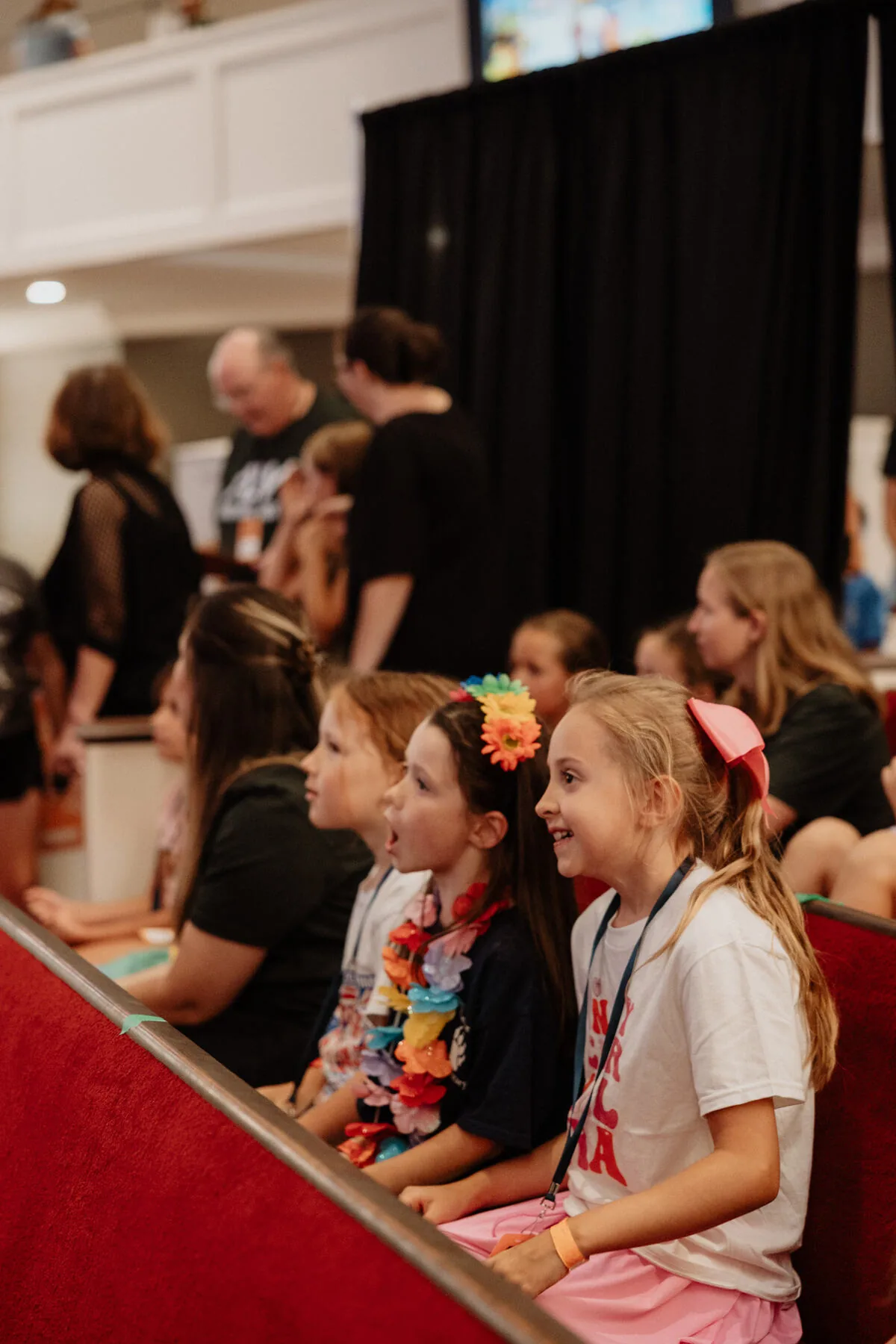 Children in the pews during the morning.