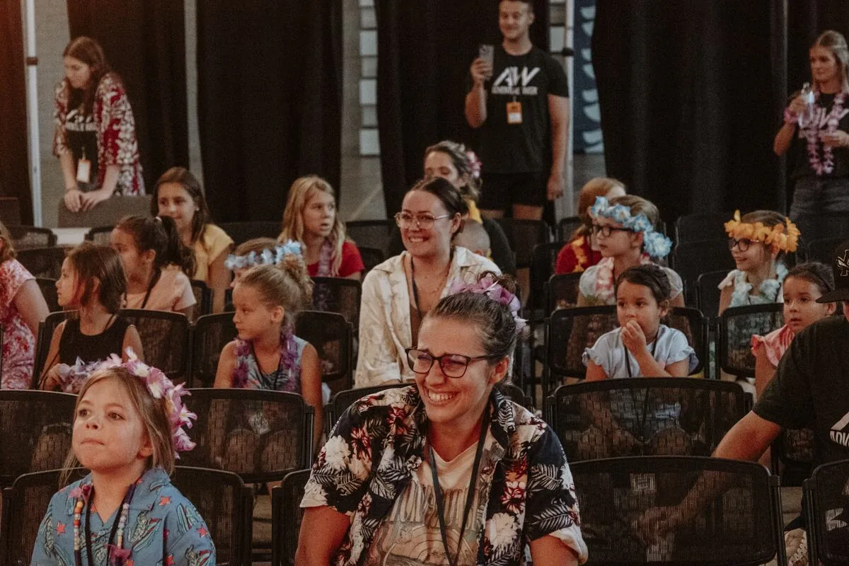 Children seated at the front of the room.