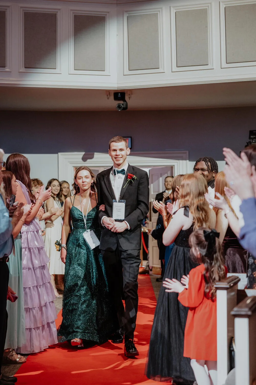 Cheering a guest down the carpet.