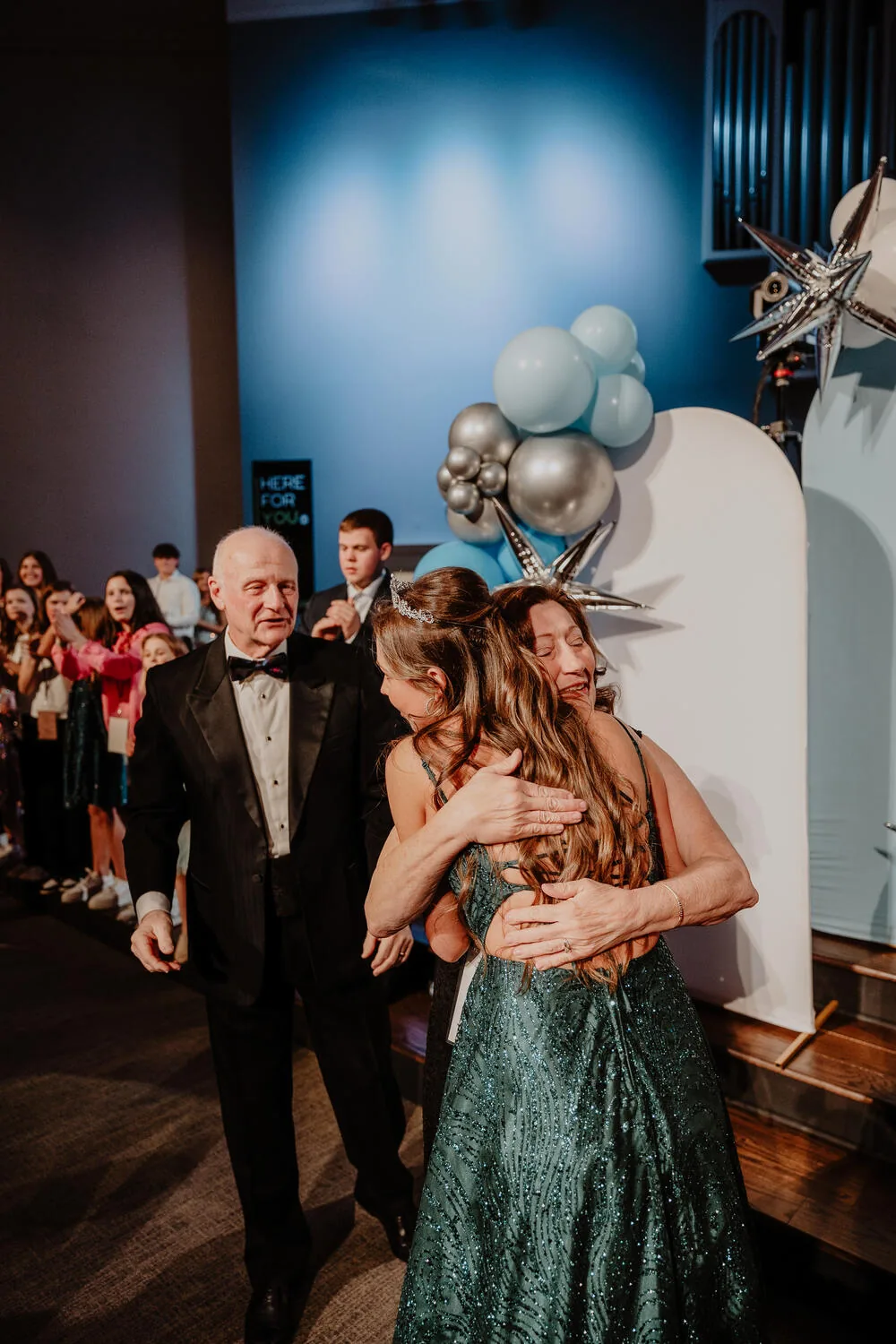A guest and a volunteer dancing.