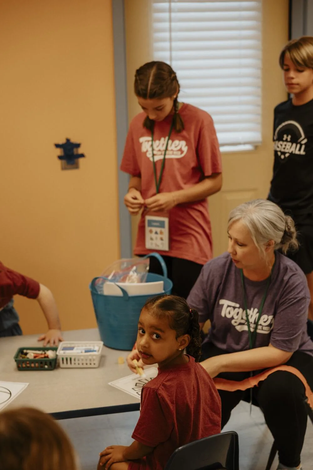 A leader and a participant at the table together.