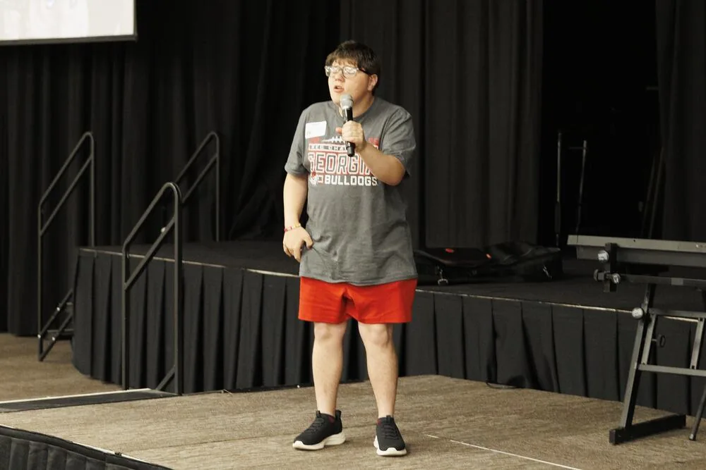 Speaking from the stage.