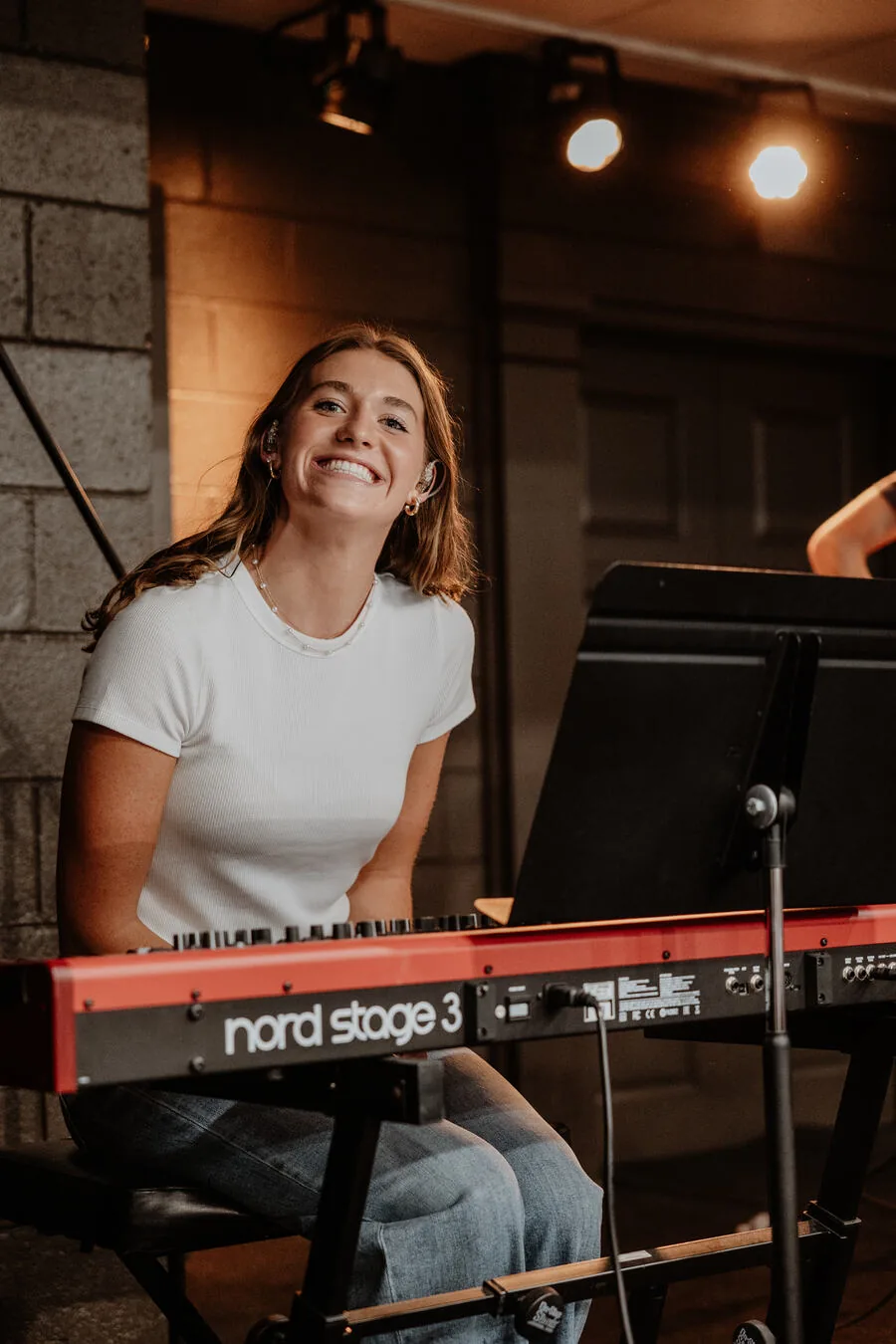 A student playing keys.