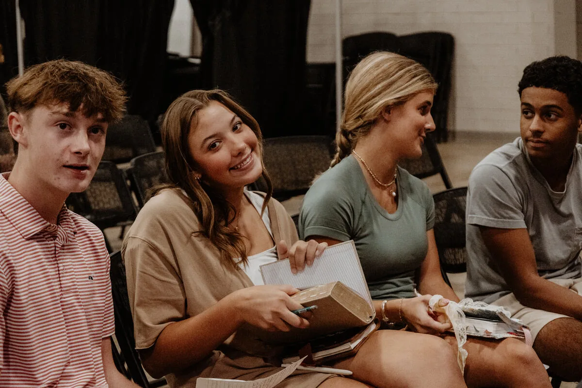 Students sitting together with their notes.