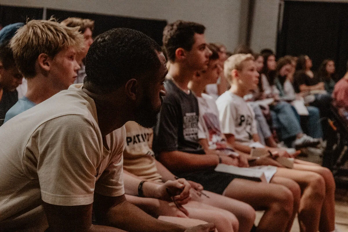 Students seated together, listening.