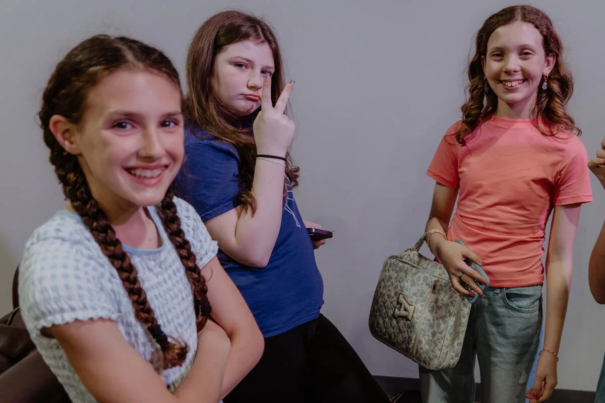 Three students together in the hallway.