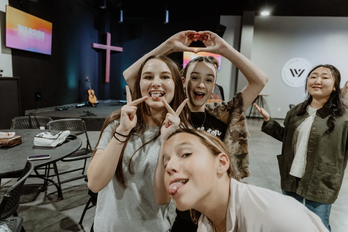 Four students clowning for the camera.