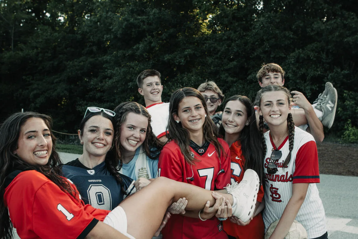 A group of students in matching jerseys.