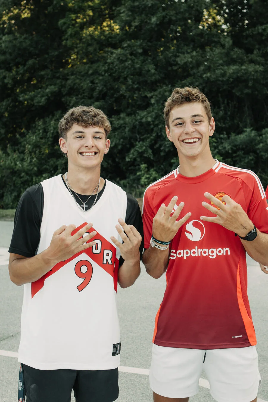 Two students posing in jerseys.