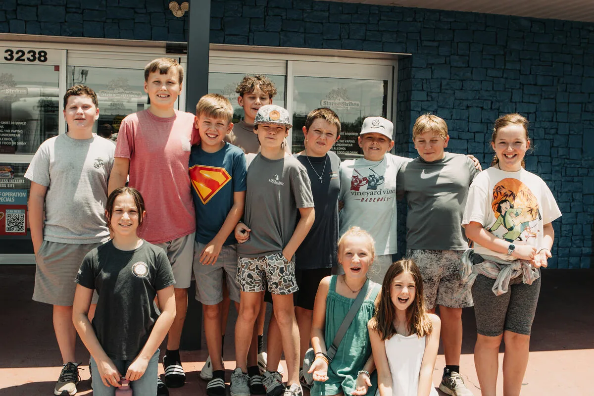 Middle school students together outside the building.