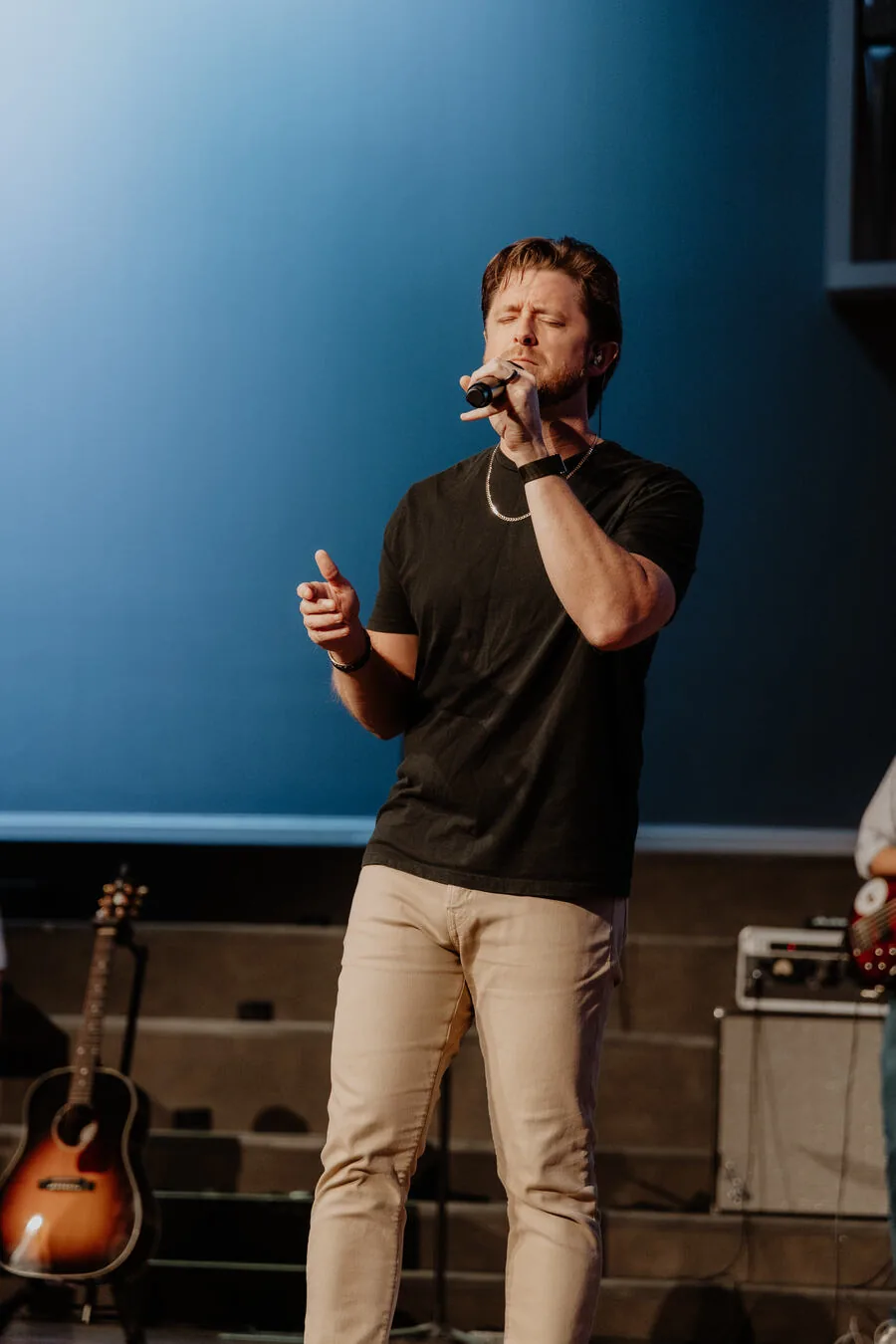 A worship leader mid-song.