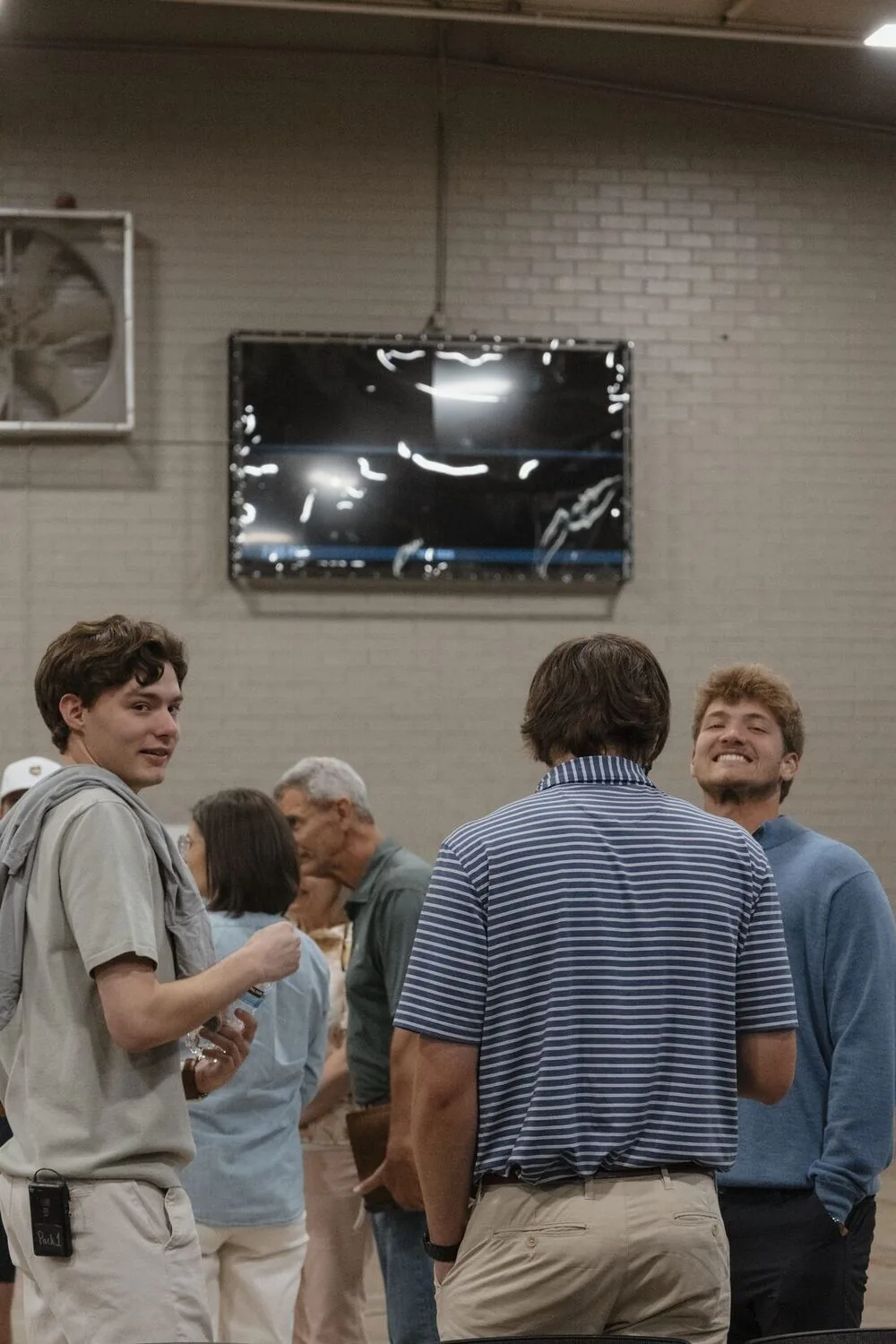 A group standing and talking after the night.